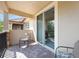Cozy patio featuring brick floors, comfortable seating, and sliding door access to the indoors at 10533 Belfry Cir, Orlando, FL 32832
