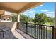 Charming outdoor patio with brick flooring and a wrought iron railing overlooking the golf course at 10533 Belfry Cir, Orlando, FL 32832