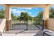 Inviting outdoor patio with stylish seating and a black iron fence, perfect for relaxation at 10533 Belfry Cir, Orlando, FL 32832