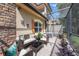 Charming outdoor patio featuring stylish wicker furniture, stone accents, and a delightful space for enjoying the fresh air at 10533 Belfry Cir, Orlando, FL 32832