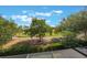 Serene view of lush landscaping and a well-maintained golf course from the property at 10533 Belfry Cir, Orlando, FL 32832