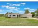Well-kept one-story home with a green lawn and attached two-car garage in a residential neighborhood at 10980 Sw 62Nd Ave, Ocala, FL 34476
