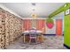 Bright dining room with unique decor including a strawberry theme and a modern light fixture at 1101 Mizell Rd, Leesburg, FL 34748