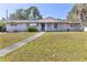 Charming single-story home with a well-maintained lawn and inviting front porch at 1101 Mizell Rd, Leesburg, FL 34748