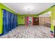 Spacious living room with colorful walls, unique flooring, and ample natural light at 1101 Mizell Rd, Leesburg, FL 34748