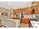 Spacious kitchen featuring stainless steel appliances, ample cabinet space, and a breakfast bar at 11556 Via Lucerna Cir, Windermere, FL 34786