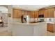 Open-concept kitchen with stainless steel appliances, ample counter space, and tile flooring at 11556 Via Lucerna Cir, Windermere, FL 34786