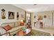Comfortable living room with neutral walls, decorative wall art, and warm tones, perfect for relaxation at 11556 Via Lucerna Cir, Windermere, FL 34786