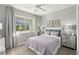 Comfortable bedroom with ample natural light, modern decor, and neutral color scheme at 13216 Pergola Ave, Orlando, FL 32832