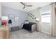 Cozy bedroom with dinosaur themed décor and space saving daybed at 13216 Pergola Ave, Orlando, FL 32832