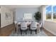 Bright dining room features stylish decor, a large window, and seating for six at 13216 Pergola Ave, Orlando, FL 32832