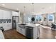 Beautiful kitchen with a farmhouse sink, modern appliances, and an open layout to the dining area at 13216 Pergola Ave, Orlando, FL 32832