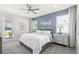 Calming main bedroom with decorative wall accents and plenty of natural light at 13216 Pergola Ave, Orlando, FL 32832