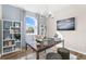 Home office features a spacious desk, shelving, and a view of the playground at 13216 Pergola Ave, Orlando, FL 32832
