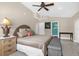 Bedroom showcasing neutral color scheme, accent pillows, and an ensuite bathroom at 1632 Oriole Ave, Orlando, FL 32803