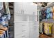 Walk-in closet with custom shelving and drawers for optimal organization at 1632 Oriole Ave, Orlando, FL 32803