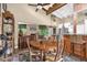 Cozy dining area features vaulted ceilings, an antique dining set, and seamless flow to the kitchen and living spaces at 1632 Oriole Ave, Orlando, FL 32803