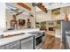 Open-concept kitchen featuring granite counters, updated appliances, and flows into the dining and living spaces at 1632 Oriole Ave, Orlando, FL 32803