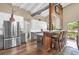 Modern kitchen boasts sleek gray cabinets, stainless steel appliances, and a seamless connection to the cozy dining area at 1632 Oriole Ave, Orlando, FL 32803