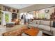 Bright and open living room with tile flooring, comfortable seating, and a view into the kitchen at 1632 Oriole Ave, Orlando, FL 32803