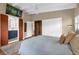 Main bedroom with vaulted ceilings and featuring an ensuite bathroom with a modern vanity at 1632 Oriole Ave, Orlando, FL 32803