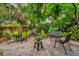 Inviting brick patio offers comfortable seating amid lush foliage, creating a perfect outdoor entertaining space at 1632 Oriole Ave, Orlando, FL 32803