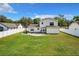 Large backyard featuring a white fence at 1668 Spicewood Ln, Casselberry, FL 32707