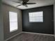 Bedroom with two windows and neutral walls and flooring at 1668 Spicewood Ln, Casselberry, FL 32707