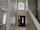 Bright entryway featuring tile flooring and a staircase at 1668 Spicewood Ln, Casselberry, FL 32707
