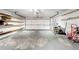 Garage with shelves and door to the driveway at 1668 Spicewood Ln, Casselberry, FL 32707