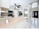 Bright kitchen with stainless steel appliances and white cabinets at 1668 Spicewood Ln, Casselberry, FL 32707