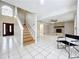 Open living space featuring a stone fireplace and staircase at 1668 Spicewood Ln, Casselberry, FL 32707