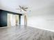 Spacious bedroom with walk-in closet and sleek, modern flooring at 1668 Spicewood Ln, Casselberry, FL 32707