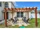Cozy pergola with stone pavers and seating for four at 1668 Spicewood Ln, Casselberry, FL 32707