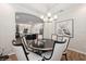Elegant dining room with patterned wallpaper, stylish lighting, and open to the kitchen for easy entertaining at 1757 Standing Rock Cir, Oakland, FL 34787