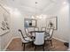 Formal dining room with patterned wallpaper and stylish lighting perfect for Gathering meals and entertaining guests at 1757 Standing Rock Cir, Oakland, FL 34787