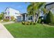 Beautiful home with attached garage, complemented by lush landscaping and mature palm trees enhancing its curb appeal at 1757 Standing Rock Cir, Oakland, FL 34787