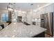 Well-lit kitchen featuring stainless steel appliances, ample cabinet space, and a large kitchen island at 1757 Standing Rock Cir, Oakland, FL 34787