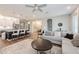 Bright living room with views of kitchen, dining area, and modern furnishings, creating an inviting space at 1757 Standing Rock Cir, Oakland, FL 34787