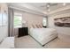 Large main bedroom with ceiling fan, bedside tables, and tufted headboard at 1757 Standing Rock Cir, Oakland, FL 34787