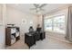 Comfortable office space with a ceiling fan, window with neighborhood views and shelving for storage at 1757 Standing Rock Cir, Oakland, FL 34787