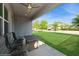 Covered patio with ceiling fan and outdoor furniture with a lawn view at 1757 Standing Rock Cir, Oakland, FL 34787