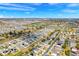 Aerial community view featuring many houses with solar panels, green areas, and blue skies at 178 Aria Way, Davenport, FL 33837