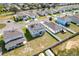 A house with solar panels in a community with green lawns and well-maintained streets at 178 Aria Way, Davenport, FL 33837