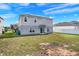 Two story home with spacious backyard, solar panels, and partial fencing at 178 Aria Way, Davenport, FL 33837