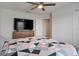 Bedroom with ceiling fan, dresser and TV at 178 Aria Way, Davenport, FL 33837