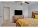 Bedroom with TV and doorway at 178 Aria Way, Davenport, FL 33837