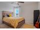 Bedroom with natural light, wooden bed frame, and guitar at 178 Aria Way, Davenport, FL 33837