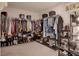 Spacious walk-in closet with ample shelving and hanging space for organized storage of clothes and accessories at 178 Aria Way, Davenport, FL 33837