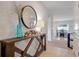 Inviting entryway featuring tiled floor, wood console table with vases, and an interior view at 178 Aria Way, Davenport, FL 33837